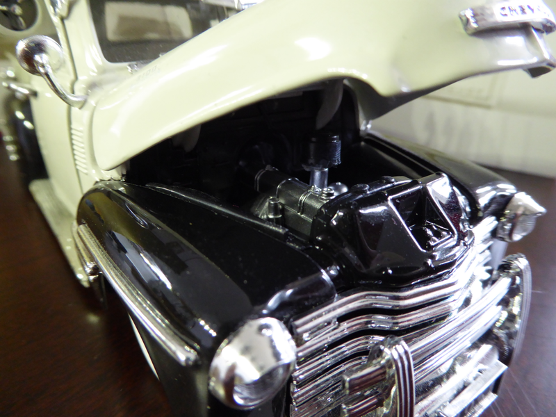 Hood has opening feature and shows a decent looking engine.